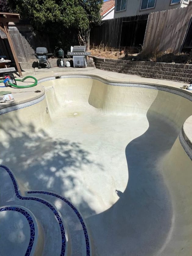 The same pool drained, cleaned out and chlorine washed by Ripple, ready to refill